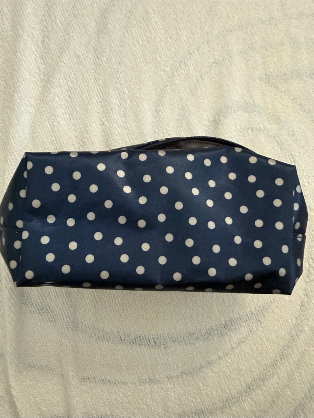 Thirty-One cosmetic bag or zipper pouch, specifically in the "Navy Dancing dots